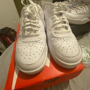 All white Nike shoes